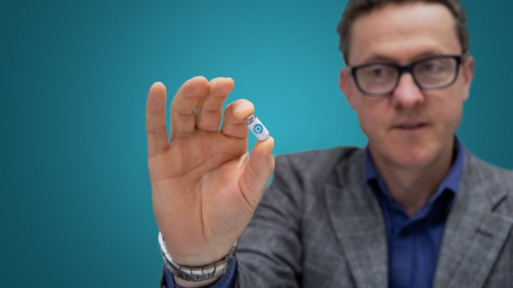 Atmo Biosciences CEO Mal Hebblewhite with the gas-sensing capsule