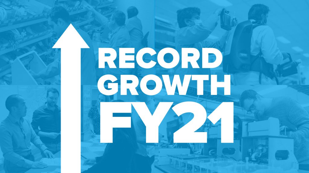 A blue graphic with arrow that says Record Growth FY21